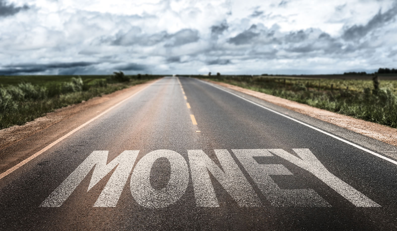 paved road with the words MONEY 