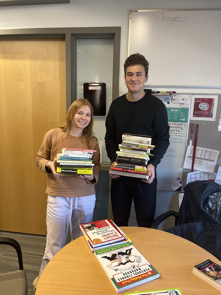 Elsa and Jackson holding books