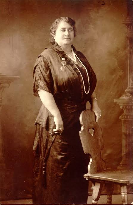 Historical photo of Maggie wearing along dress