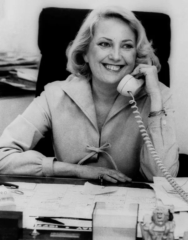 muriel siebert sitting in chair while on the phone