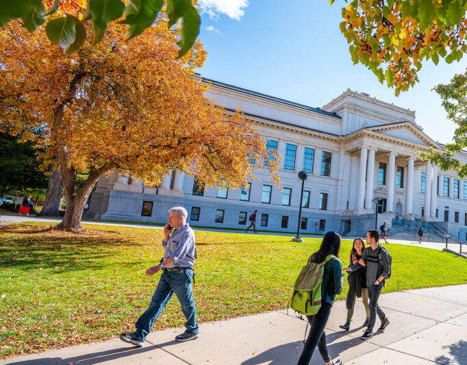 people walking in front of Presidents Circle on a fall day