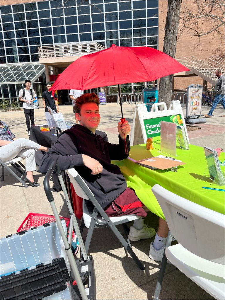 jackson tabling holidng an umbrella